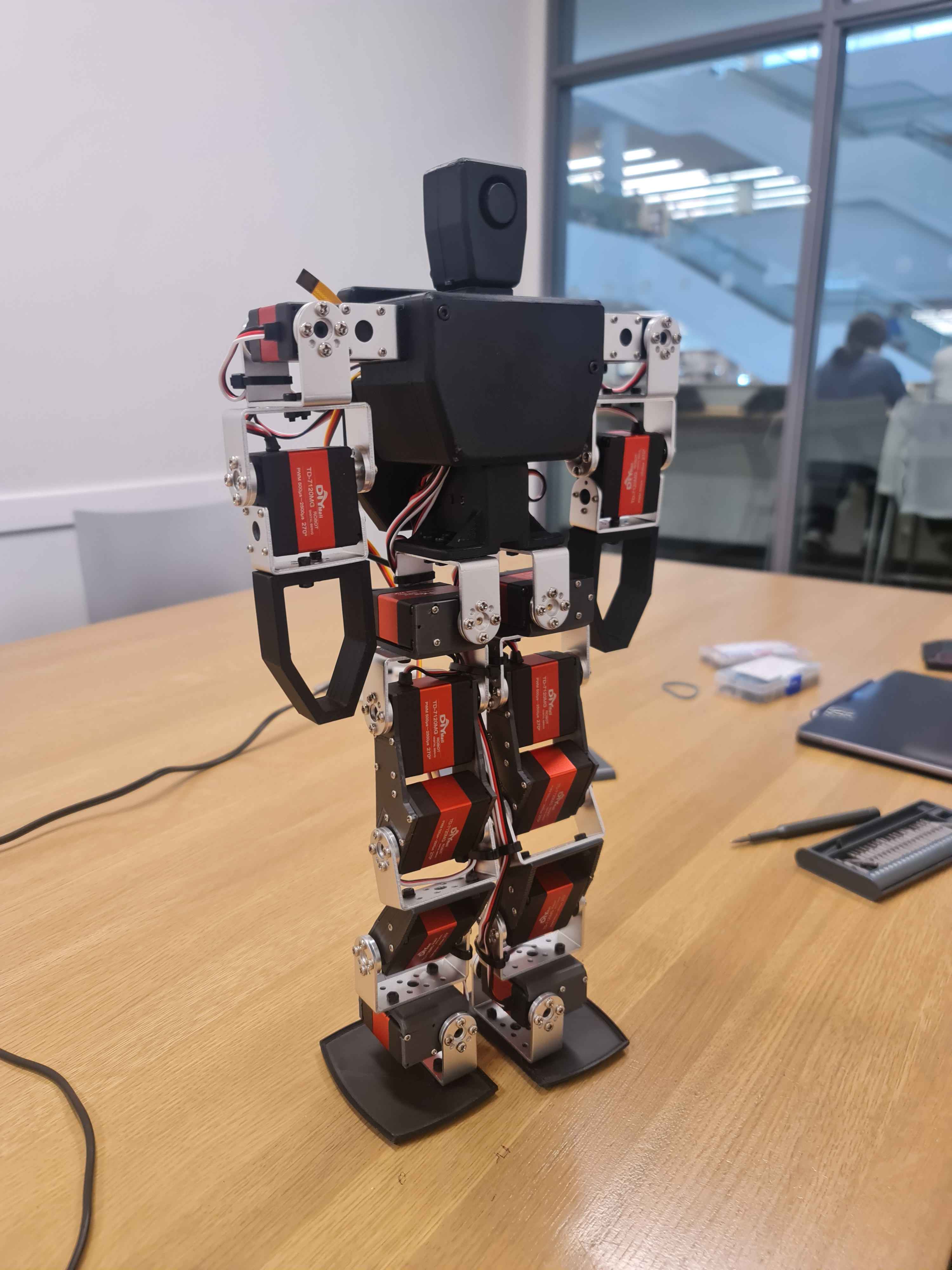 The physical 15-DOF servo humanoid on a workbench